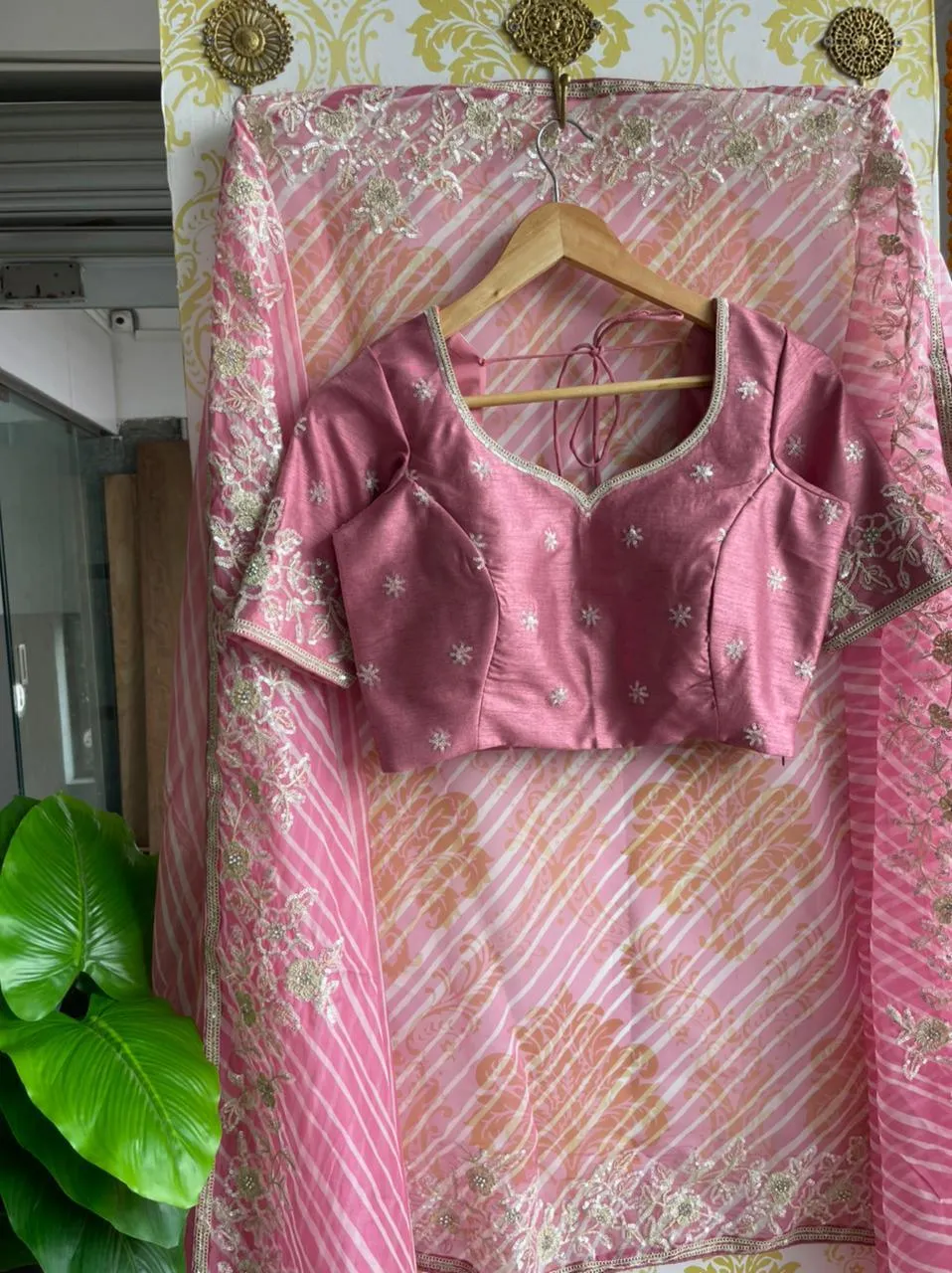 Lehariya pink organza saree with blue hand worked blouse