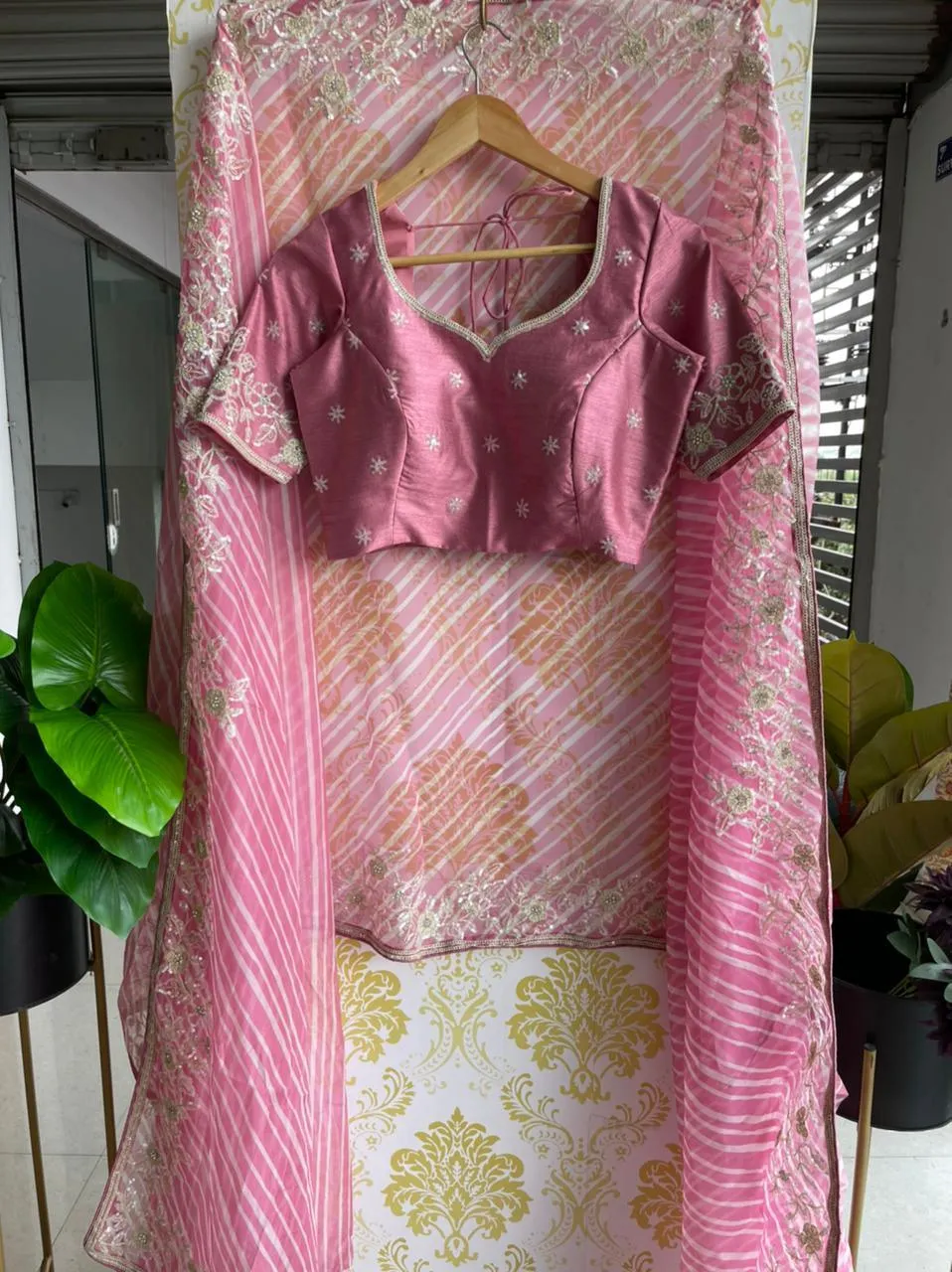 Lehariya pink organza saree with blue hand worked blouse